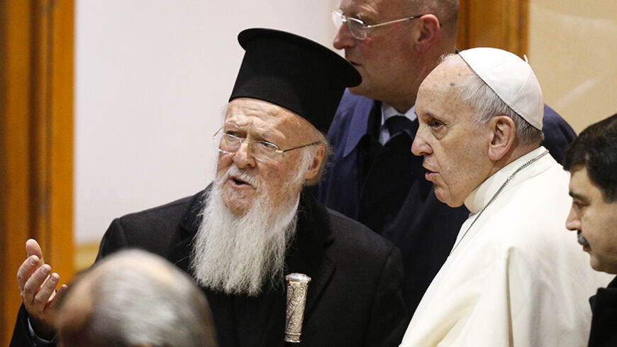 Ecumenical Patriarch Bartholomew I of Constantinople (2L) accompanies Pope Francis as he departs from Istanbul after a three day visit, November 30, 2014. Pope Francis said Islamic militants were carrying out a "profoundly grave sin against God" in Syria and Iraq, calling on Sunday for inter-religious dialogue and action against poverty to help end the conflicts there.   REUTERS/Stoyan Nenov (TURKEY  - Tags: POLITICS RELIGION)   - RTR4G4WB