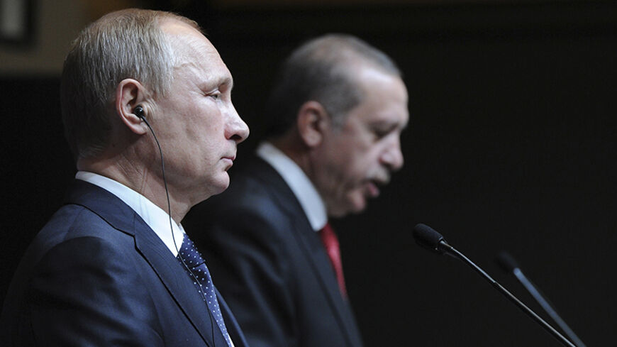 Russia's President Vladimir Putin (L) is pictured during a joint news conference with his Turkish counterpart Tayyip Erdogan in Ankara December 1, 2014. Putin said on Monday that Moscow could not carry on with the South Stream project if the European Union was opposed to it. Speaking at a joint news conference with Turkish President Erdogan, Putin said the European Commission was reluctant to give the green light to the South Stream project.  REUTERS/Mikhail Klimentyev/RIA Novosti/Kremlin (TURKEY - Tags: PO