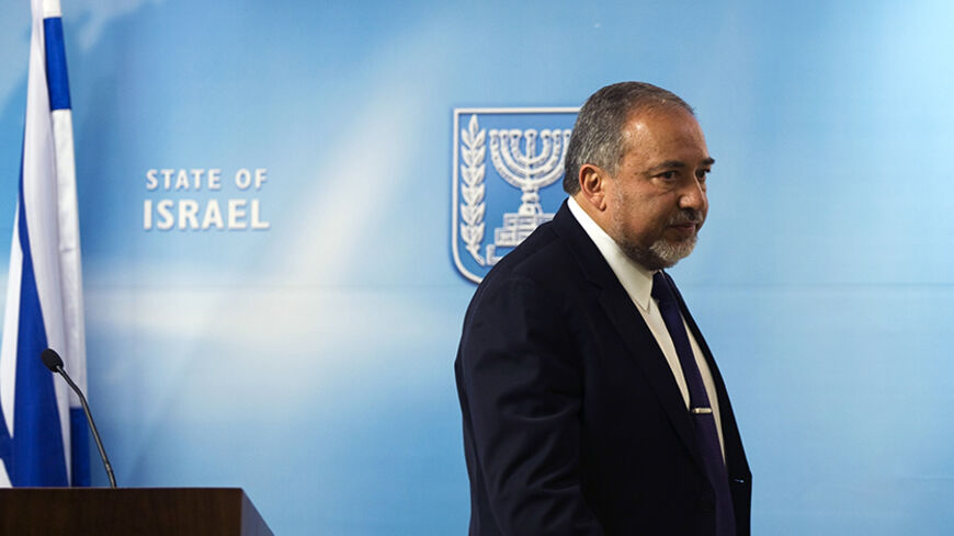 Israel's Foreign Minister Avigdor Lieberman leaves after giving a statement to the media at his Jerusalem office December 2, 2014. Israel appeared to be heading on Tuesday towards an early election after right-wing Prime Minister Benjamin Netanyahu and his major centrist coalition partner failed to patch up differences. Foreign Minister Avigdor Lieberman, head of the far-right Yisrael Beitenu party, told a news conference, "An election is a now a fact."  REUTERS/ Ronen Zvulun (JERUSALEM - Tags: POLITICS) - 