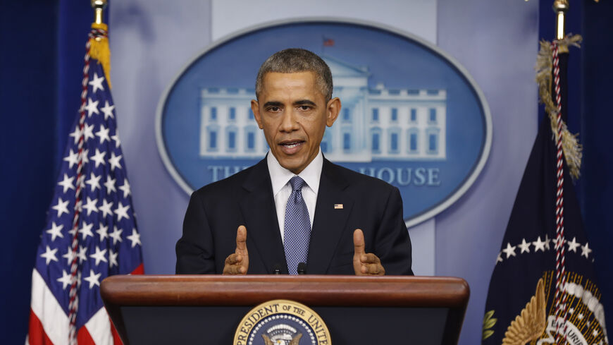 U.S. President Barack Obama answers questions after his end of the year press conference in the briefing room of the White House in Washington, December 19, 2014. Obama and his family plan to depart Washington later in the day to spend the holidays in Hawaii. REUTERS/Larry Downing (UNITED STATES  - Tags: POLITICS)   - RTR4IQKI