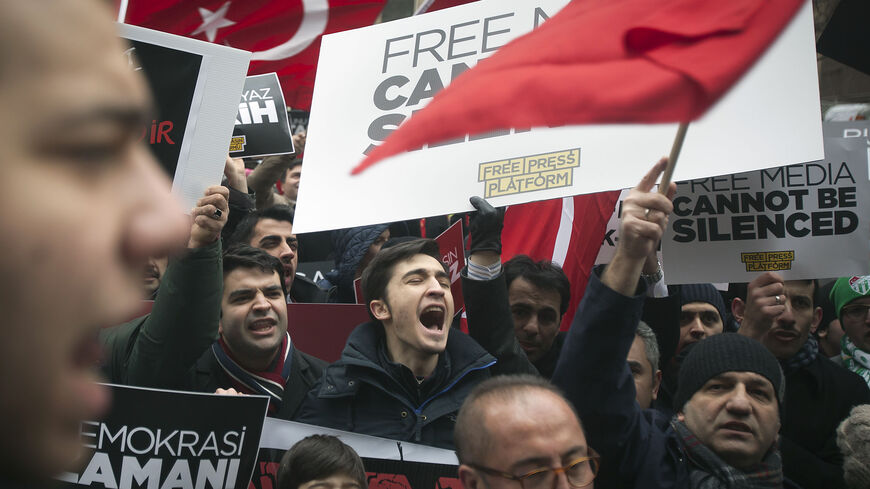 People take part in a protest against the Turkish Government for issuing an arrest warrant for U.S.-based Muslim cleric Fethullah Gulen in the Manhattan borough of New York, December 20, 2014. A Turkish court issued an arrest warrant on Friday for the U.S.-based cleric whose followers are accused by President Tayyip Erdogan of leading a terrorist plot to seize power, according to media.            REUTERS/Carlo Allegri      (UNITED STATES - Tags: CIVIL UNREST POLITICS) - RTR4ISVE