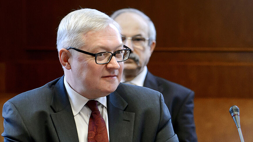 Russian Deputy Foreign Minister Sergei Ryabkov looks on at the start of two days of closed-door nuclear talks at the United Nations offices in Geneva October 15, 2013. Iran will face pressure on Tuesday to propose scaling back its nuclear programme to win relief from crippling sanctions as talks between world powers and Tehran resume after a six-month hiatus. REUTERS/Fabrice Coffrini/Pool (SWITZERLAND - Tags: ENERGY POLITICS) - RTX14BOO