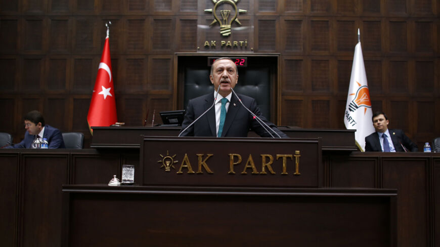 Turkey's Prime Minister Tayyip Erdogan addresses members of parliament from his ruling AK Party (AKP) during a meeting at the parliament in Ankara January 14, 2014. Erdogan looks to have the upper hand in a civil war rocking Turkey's political establishment, but his bid to break the influence of a potent Islamic cleric could roll back reforms and undermine hard-won business confidence. What erupted a month ago as a damaging inquiry into alleged government corruption has spiralled into a battle over the judi