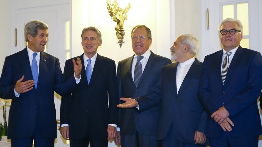U.S. Secretary of State John Kerry, Britain's Foreign Secretary Philip Hammond, Russian Foreign Minister Sergei Lavrov, Iranian Foreign Minister Javad Zarif and German Foreign Minister Frank-Walter Steinmeier (LtoR) pose for photographers before a meeting in Vienna November 24, 2014. Iran, the United States and other world powers are all but certain to miss Monday's deadline for negotiations to resolve a 12-year stand-off over Tehran's atomic ambitions, forcing them to seek an extension, sources say. The ta