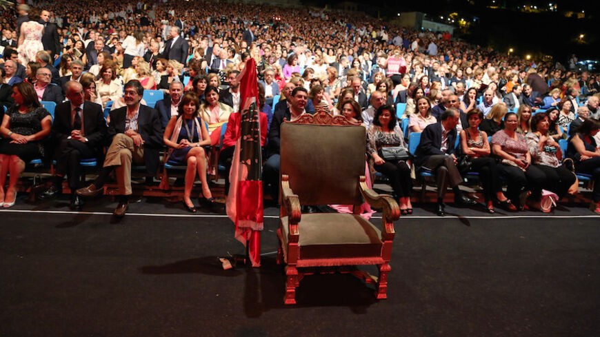 An empty chair representing the Lebanese president is pictured at the opening of the Beiteddine International Festival in Beiteddine, Mount Lebanon, June 26, 2014. The annual entertainment festival takes place in the Ottoman Ruins of the Beiteddine Palace. Lebanese parliamentarians have not elected a new president since former President Michel Suleiman's term ended.   REUTERS/Sharif Karim (LEBANON - Tags: POLITICS ENTERTAINMENT) - RTR3VYUF