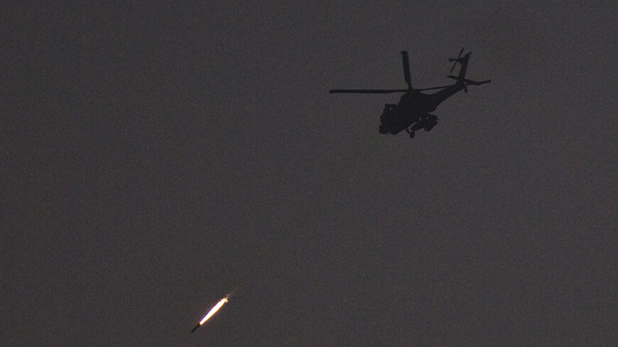 An Israeli Apache helicopter fires a missile towards the Gaza Strip July 22, 2014. Israel pounded targets across the Gaza Strip on Tuesday, saying no ceasefire was near as top U.S. and United Nations diplomats pursued talks on halting the fighting that has claimed more than 600 lives. With the conflict entering its third week, the Palestinian death toll rose to 616, including nearly 100 children and many other civilians, Gaza health officials said. Israel's casualties also mounted, with the military announc