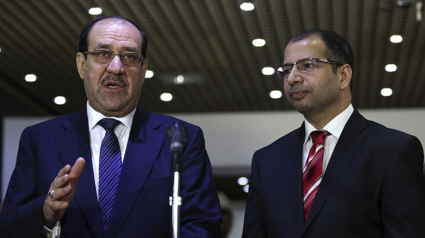 Iraqi Prime Minister Nuri al-Maliki (L) speaks next to speaker of parliament Salim al-Jabouri during a news conference after their meeting with in Baghdad July 26, 2014. Gunmen in army uniforms have seized a senior local official and prominent member of a Sunni Islamist party from his Baghdad home, police and security officials said on Saturday. It was not clear if Riyadh al-Adhdah, who heads Baghdad's Provincial Council and belongs to the Sunni Islamist Iraqi Islamic Party, had been kidnapped by militiamen