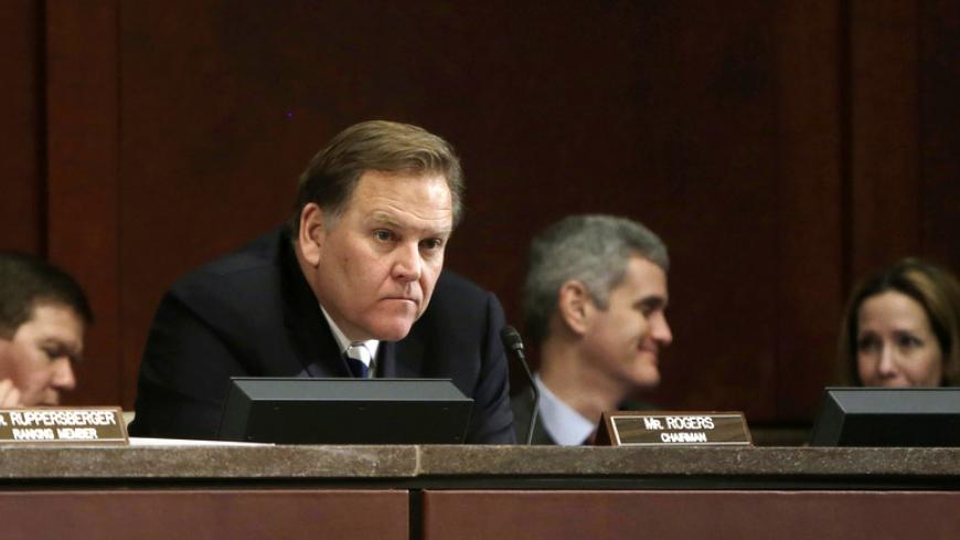 Chairman U.S. Rep. Mike Rogers (R-MI) (C) listens to testimony at the House Intelligence Committee on "Worldwide Threats", in Washington February 4, 2014.        REUTERS/Gary Cameron  (UNITED STATES - Tags: CRIME LAW POLITICS MILITARY) - RTX187U2