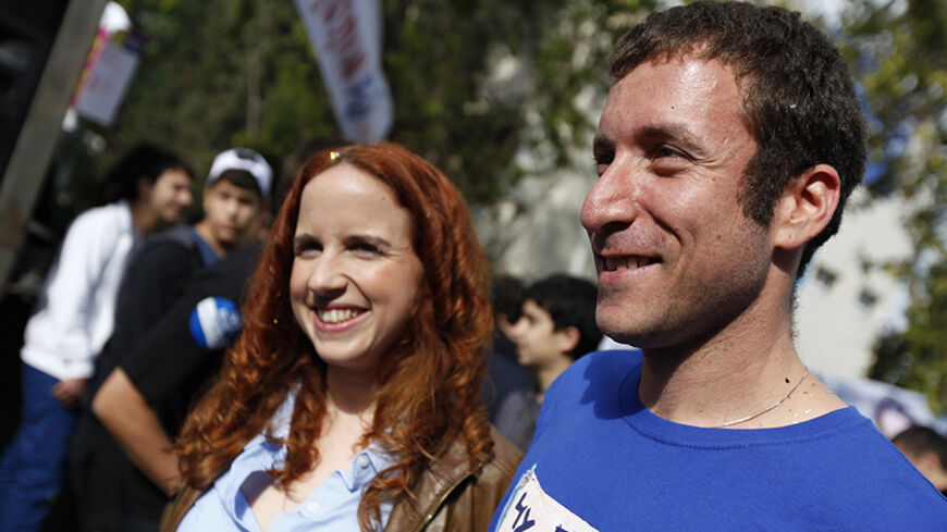 Labour party candidates Itzik Shmuli (R) and Stav Shaffir attend a mock election at a high school in Ramat Gan near Tel Aviv December 6, 2012. The leaders of a grassroots social protest movement that swept Israel in 2011, Shaffir and Shmuli, have shot to the top of a rejuvenated Labour party that polls say will at least double its power in a Jan. 22 general election that Prime Minister Benjamin Netanyahu's right-wing Likud is forecast to win. Picture taken December 6, 2012. REUTERS/Amir Cohen (ISRAEL - Tags