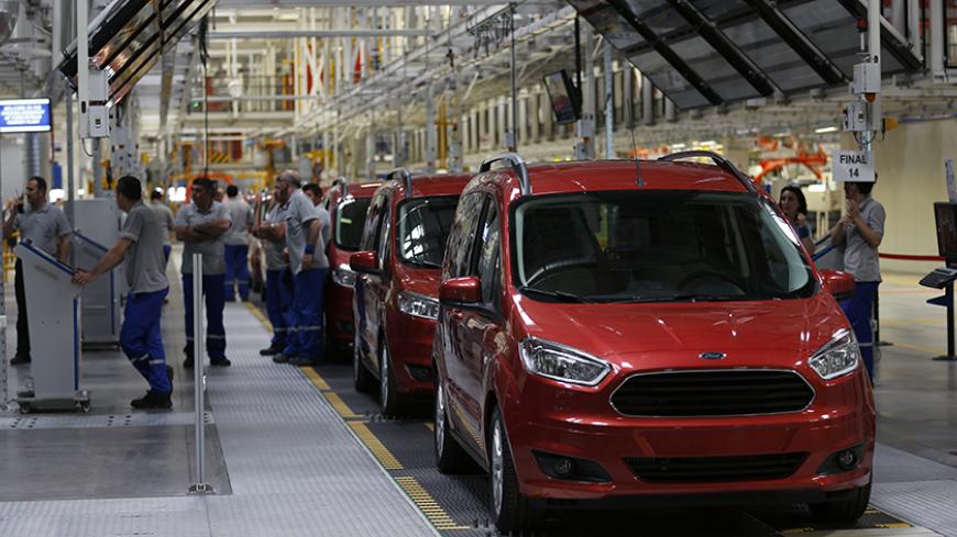 Ford Tourneo Courier light commercial vehicles are seen at the Ford Otosan Yenikoy car plant in Kocaeli May 22, 2014. REUTERS/Murad Sezer (TURKEY  - Tags: TRANSPORT BUSINESS) - RTR3QFUD