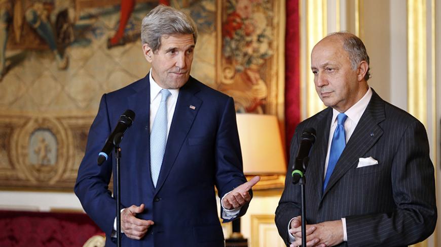 French Foreign Minister Laurent Fabius (R) and U.S. Secretary of State John Kerry speak during joint statement at the Quai d'Orsay Foreign Affairs ministry in Paris November 20, 2014. U.S. Secretary of State John Kerry is in Paris for talks with the French and Saudi foreign ministers as part of a last-minute push to secure a nuclear deal with Iran. Kerry will travel to Vienna later on Thursday to participate in a conference with world powers and Iran on Tehran's nuclear programme, a spokeswoman said.  REUTE