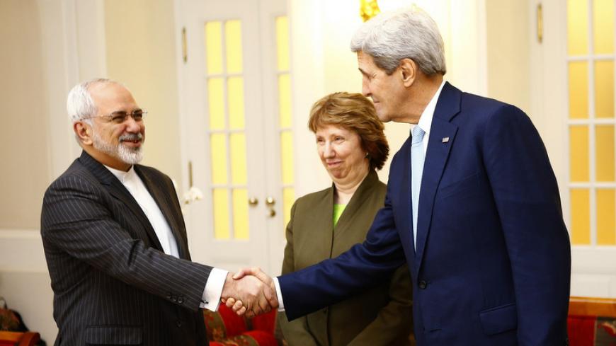 U.S. Secretary of State John Kerry (R) and Iranian Foreign Minister Javad Zarif (L) shake hands, as EU envoy Catherine Ashton watches, before a meeting in Vienna November 20, 2014. Tehran has yet to explain away allegations it conducted atomic bomb research, the head of the U.N. nuclear agency said on Thursday, four days before a deadline for Iran and six world powers to reach a deal on the Iranian nuclear programme. REUTERS/Leonhard Foeger (AUSTRIA - Tags: POLITICS ENERGY) - RTR4EXYQ
