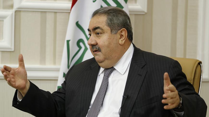 Iraq's Finance Minister Hoshiyar Zebari speaks during an interview with Reuters in Baghdad November 26, 2014. Zebari called for deep-rooted reforms to stamp out corruption in a military that collapsed in the face of an Islamic State advance, as he prepares to spend nearly a quarter of the 2015 budget on defence. Picture taken November 26, 2014.  REUTERS/Thaier Al-Sudani (IRAQ - Tags: BUSINESS POLITICS MILITARY CIVIL UNREST) - RTR4FT0T