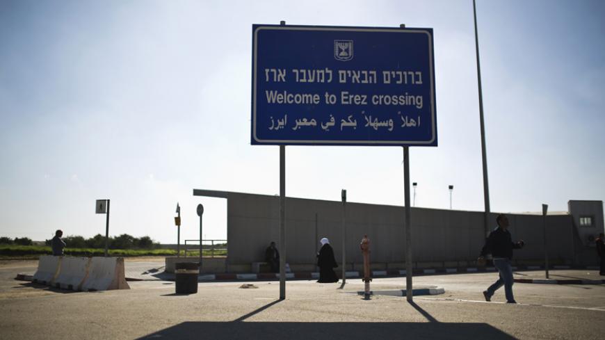 A sign is seen at the Erez border crossing between Israel and northern Gaza Strip December 28, 2014. Hamas authorities in the Gaza Strip prevented on Sunday a group of Palestinian children who lost parents in the July-August war with Israel from making a rare goodwill visit to the Jewish state, organisers of the trip said. REUTERS/Amir Cohen (ISRAEL - Tags: POLITICS CIVIL UNREST) - RTR4JF9V