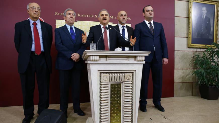 (From L to R) Republican People's Party (CHP) MPs Riza Turmen, Osman Koruturk, Levent Gok, Erdal Aksunger and Emre Koprulu attend a news conference in Ankara January 5, 2015. A Turkish parliamentary commission voted on Monday not to send four former ministers accused in a corruption investigation to the Supreme Court for trial, effectively backing President Tayyip Erdogan after a scandal that had rattled his inner circle. REUTERS/Umit Bektas (TURKEY - Tags: POLITICS CRIME LAW) - RTR4K4TW