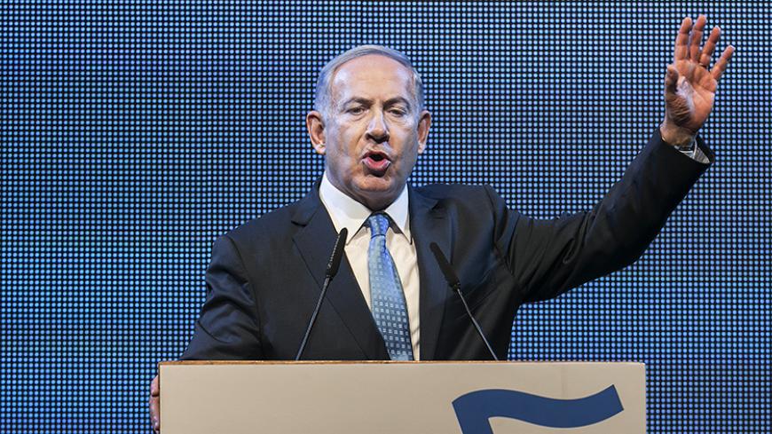 Israel's Prime Minister Benjamin Netanyahu gestures as he delivers a speech during the launch of his Likud party election campaign in Tel Aviv January 5, 2015. Netanyahu was re-elected head of the right-wing Likud party last week, overcoming his first hurdle toward winning a fourth term in office in a March general election. REUTERS/Baz Ratner (ISRAEL - Tags: POLITICS ELECTIONS) - RTR4K5IA