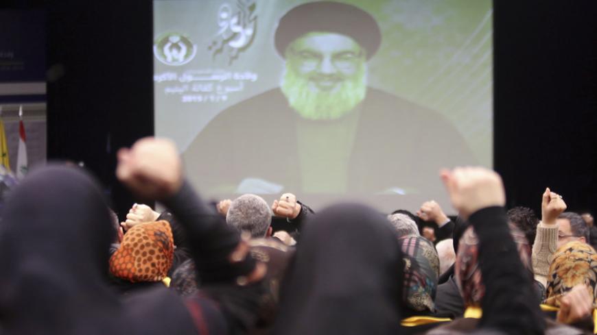 Lebanon's Hezbollah leader Sayyed Hassan Nasrallah addresses his supporters via a screen during a ceremony celebrating the birthday anniversary of Prophet Mohammed in Beirut's southern suburbs, January 9, 2015.  REUTERS/Hasan Shaaban (LEBANON - Tags: POLITICS RELIGION) - RTR4KQOH