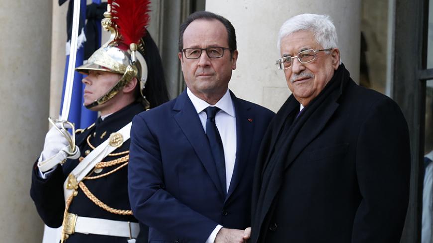 French President Francois Hollande (L) welcomes Palestinian President Mahmoud Abbas (R) at the Elysee Palace before attending a solidarity march (Marche Republicaine) in the streets of Paris January 11, 2015. Hundreds of thousands of French citizens will be joined by dozens of foreign leaders, among them Arab and Muslim representatives, in a march on Sunday in an unprecedented tribute to this week's victims following the shootings by gunmen at the offices of the satirical weekly newspaper Charlie Hebdo, the