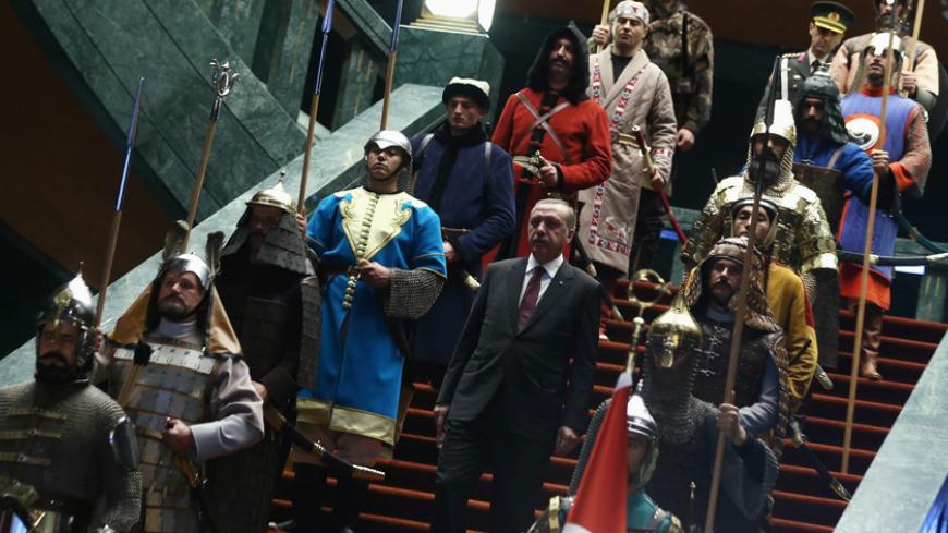 Turkey's President Tayyip Erdogan walks down the stairs in between soldiers, wearing traditional army uniforms from the Ottoman Empire, as he arrives for a welcoming ceremony for Palestinian President Mahmoud Abbas (not pictured) at the Presidential Palace in Ankara January 12, 2015. REUTERS/Adem Altan/Pool (TURKEY - Tags: POLITICS) - RTR4L487