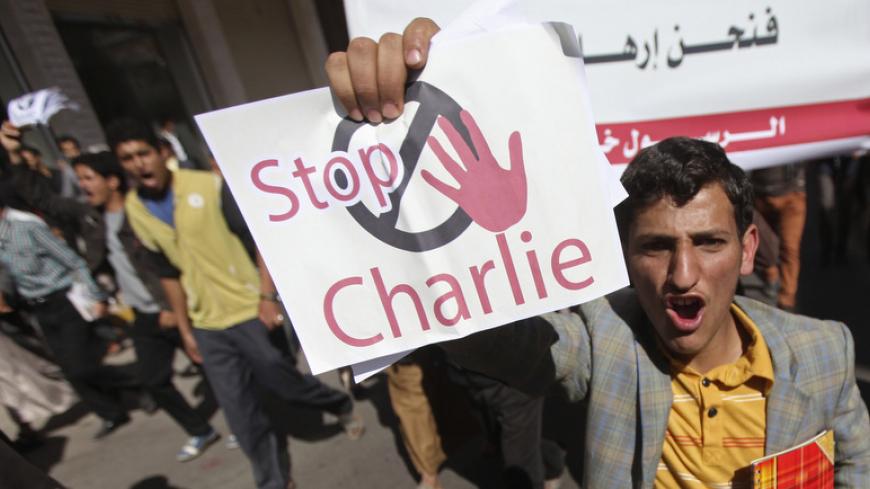 A protester shouts slogans during a demonstration against satirical French weekly Charlie Hebdo, which featured a cartoon of the Prophet Mohammad as the cover of its first edition since an attack by Islamist gunmen, in front of the French embassy in Sanaa January 17, 2015. REUTERS/Mohamed al-Sayaghi (YEMEN - Tags: CIVIL UNREST) - RTR4LS4B