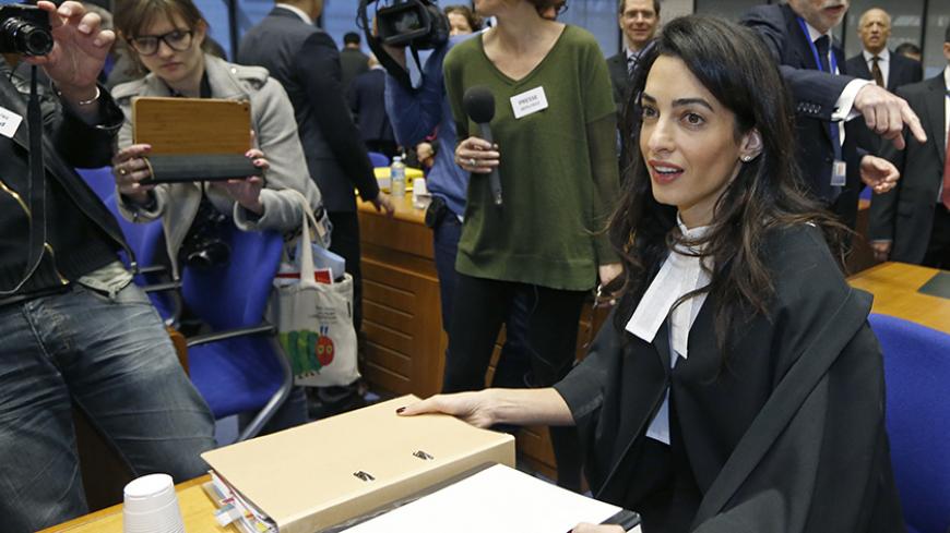 Human rights lawyer Amal Alamuddin Clooney arrives to attend a hearing at the European court of Human Rights in Strasbourg, January 28, 2015. Clooney and her colleague Robertson will represent Armenia during a hearing on the case of Dogu Perincek, Chairman of the Turkish Workers Party, against Switzerland. Perincek was found guilty of racial discrimination by a Swiss Police Court for having publicly denied the characterisation of genocide, without calling into question the existence of massacres and deporta