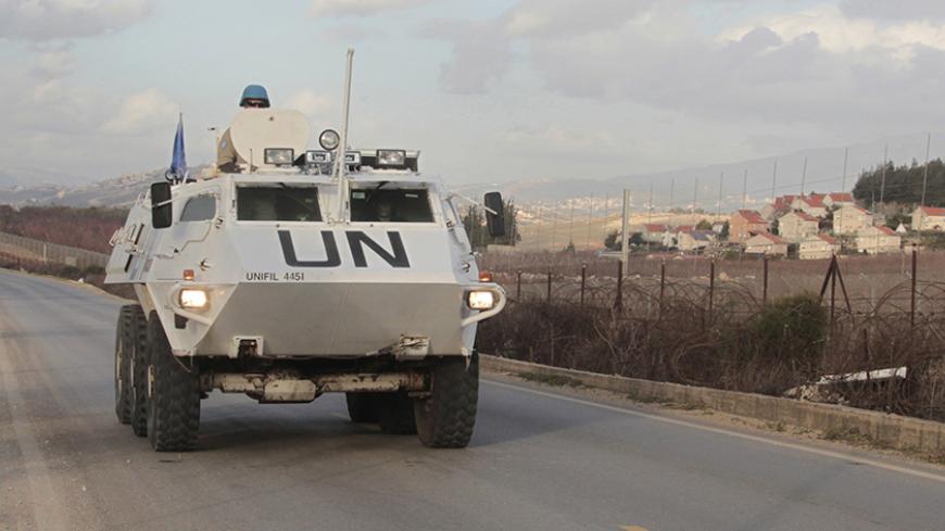 U.N. peacekeepers of the United Nations Interim Force in Lebanon (UNIFIL) patrol in Kfar Kila village in south Lebanon, near the border with Israel, January 28, 2015. Two Israeli soldiers and a Spanish peacekeeper were killed on Wednesday in an exchange of fire between Hezbollah and Israel that has raised the threat of a full-blown conflict between the militant Islamist group and Israel. REUTERS/Aziz Taher (LEBANON - Tags: CIVIL UNREST CONFLICT POLITICS MILITARY) - RTR4NCBP