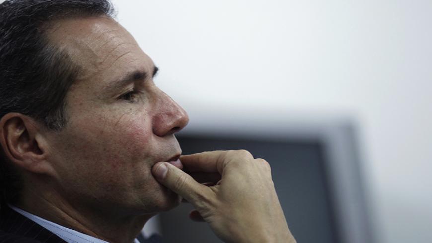 Argentine prosecutor Alberto Nisman, who is investigating the 1994 car-bomb attack on the AMIA Jewish community center, pauses during a meeting with journalists at his office in Buenos Aires May 29, 2013. Nisman accused Iran on Wednesday of creating networks to carry out terrorist attacks in Latin America since the 1980's, and he said he will send his findings to courts in those countries so they can take action.  REUTERS/Marcos Brindicci (ARGENTINA - Tags: POLITICS CRIME LAW) - RTX105FT