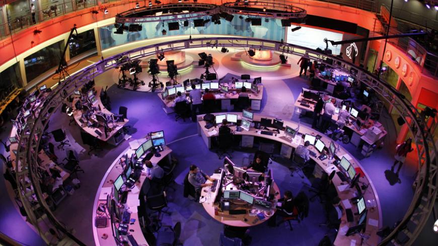 A general view shows the newsroom at the headquarters of the Qatar-based Al Jazeera English-language channel in Doha February 7, 2011. As much as CNN capitalized on its coverage of the 1990-91 Gulf War, Al Jazeera English has won praise for its on-the-spot reporting and context about the Egyptian protests. It will be talking to U.S. cable operators about deals "in the coming days and weeks," Al Anstey, managing director of Al Jazeera's English-language service said in a telephone interview from Qatar. REUTE