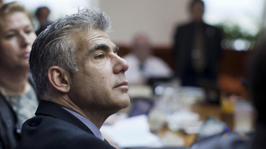 Israel's Finance Minister Yair Lapid attends the weekly cabinet meeting in Jerusalem May 13, 2013. Israel's cabinet members were discussing on Monday their approval of the 2013-2014 state budget. REUTERS/Uriel Sinai/Pool (JERUSALEM - Tags: POLITICS BUSINESS) - RTXZKVZ