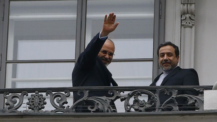 Iranian Foreign Minister Javad Zarif (L) and Abbas Araghchi, Iran's chief nuclear negotiator, stand on the balcony of Palais Coburg during a meeting between Iran and six world powers in Vienna November 22, 2014. Iran, the United States, Britain, France, Germany, Russia and China began the final round of negotiations on a nuclear deal on Tuesday. Officials close to the talks have said the two sides are unlikely to secure a final agreement and may need to extend the negotiations.      REUTERS/Leonhard Foeger 