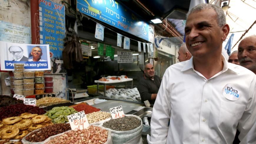 Israeli politician and popular former Likud minister Moshe Kahlon visits the Jerusalem outdoors Mahne Yehuda market on January 21, 2015 during his campaign for the upcoming general election. Kahlon, who in November 2014 announced a comeback, is at the head of a new centre-right party called "Kulanu" (All Of Us). AFP PHOTO / GALI TIBBON        (Photo credit should read GALI TIBBON/AFP/Getty Images)