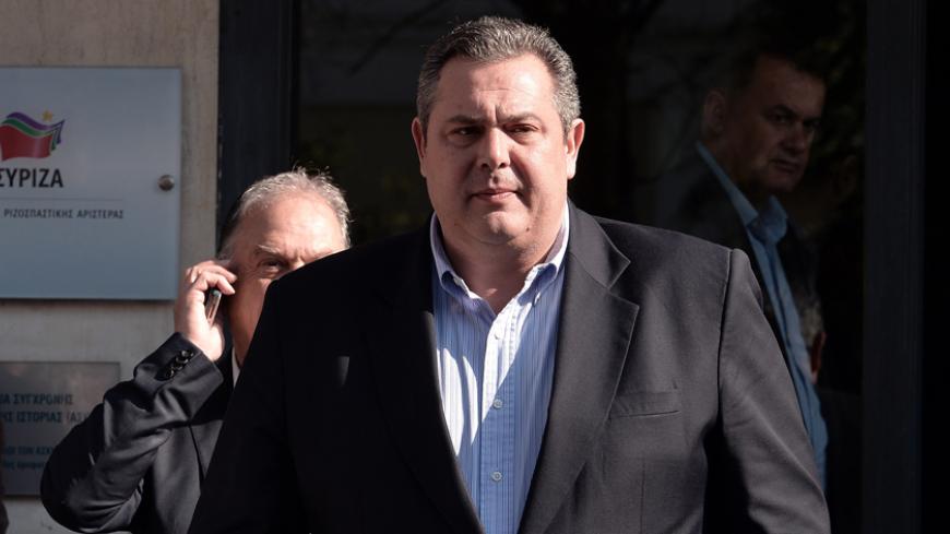 Independent Greeks leader Panos Kammenos leaves the Syriza offices after a meeting with Syriza's leader on January 26, 2015. The small Greek nationalist Independent Greeks party will join a coalition government under anti-austerity party Syriza, their leader said on January 26, 2015. "From this moment on there is a government, we will give a vote of confidence to the new prime minister," Independent Greeks leader Panos Kammenos said after meeting Syriza leader Alexis Tsipras, the winner of Sunday's general 