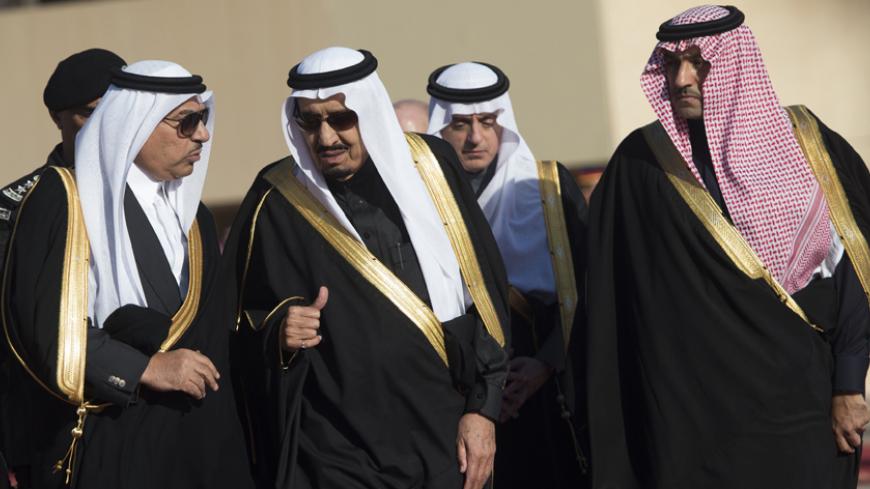 Saudi new King Salman (C) speaks with Crown Prince and Interior Minister Mohammed bin Nayef (L) as they walk to greet US President Barack Obama (unseen) and First Lady Michelle Obama (unseen) at King Khalid International Airport in Riyadh on January 27, 2015. Obama landed in Saudi Arabia to shore up ties with new King Salman and offer condolences after the death of his predecessor Abdullah. AFP PHOTO / SAUL LOEB        (Photo credit should read SAUL LOEB/AFP/Getty Images)