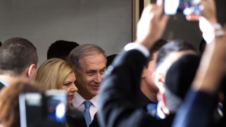 Israeli Prime Minister and Likud party leader Benjamin Netanyahu and his wife Sara arrive at an election campaign meeting with members of Israel's French Jewish community, at a Jerusalem hotel on February 8, 2015, ahead of the March 17 general elections. AFP PHOTO/MENAHEM KAHANA        (Photo credit should read MENAHEM KAHANA/AFP/Getty Images)