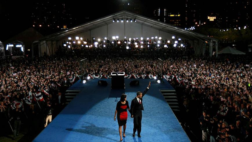 CHICAGO - NOVEMBER 04:  U.S. President elect Barack Obama and his wife Michelle wave to the crowd as they walk off stage after Obama gave his victory speech during an election night gathering in Grant Park on November 4, 2008 in Chicago, Illinois. Obama defeated Republican nominee Sen. John McCain (R-AZ) by a wide margin in the election to become the first African-American U.S. President elect.  (Photo by Justin Sullivan/Getty Images)