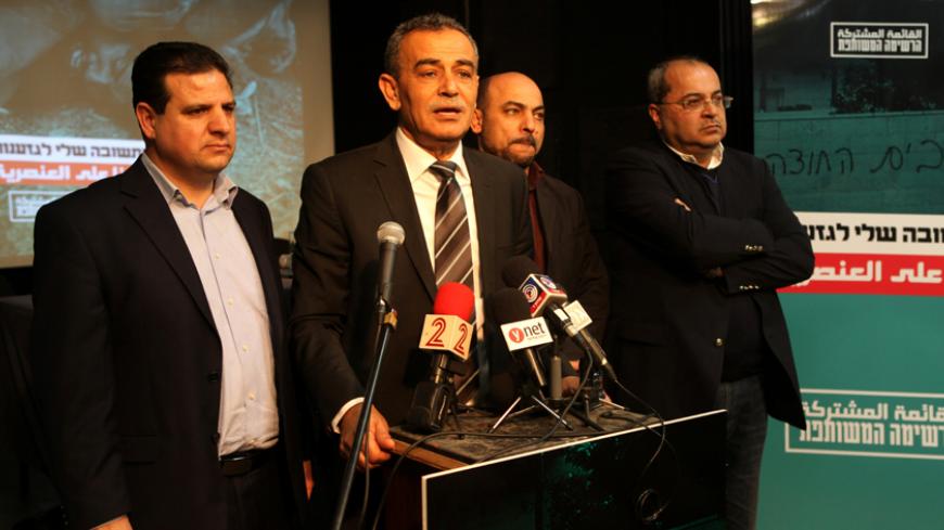 Israeli parliament member Jamal Zahalka delivers a speech as fellow members of the Arab united list for Israel general elections, Israeli-Arab lawyer Ayman Odeh (L), MPs Masud Ghanayem (2nd R) and  Ahmad Tibi (R) listen during a press conference in Tel Aviv on February 11, 2015. For the first time since the creation of Israel in 1948, several Arab Israeli parties have come together to present a united front at the next general elections in March AFP PHOTO/GIL COHEN-MAGEN        (Photo credit should read GIL