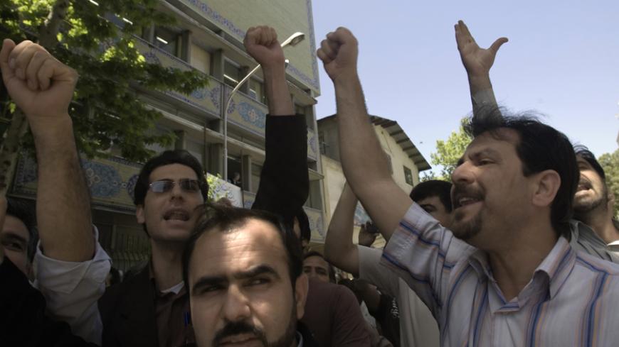 Iranian teachers take part in a rally asking for better pay in front of a Education Ministry building in Tehran May 2, 2007. REUTERS/Raheb Homavandi (IRAN) - RTR1P963