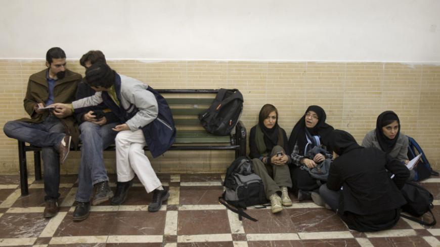 Students rest at a university while waiting for a final exam in Tehran January 18, 2009. As Barack Obama moves into the White House promising more engagement with Iran's rulers while threatening tougher sanctions, the radicalism of the embassy hostage-takers has given way to cautious hope among many in Iran's universities. Picture taken January 18. To match feature IRAN-OBAMA/STUDENTS REUTERS/Morteza Nikoubazl (IRAN) - RTR23LEE