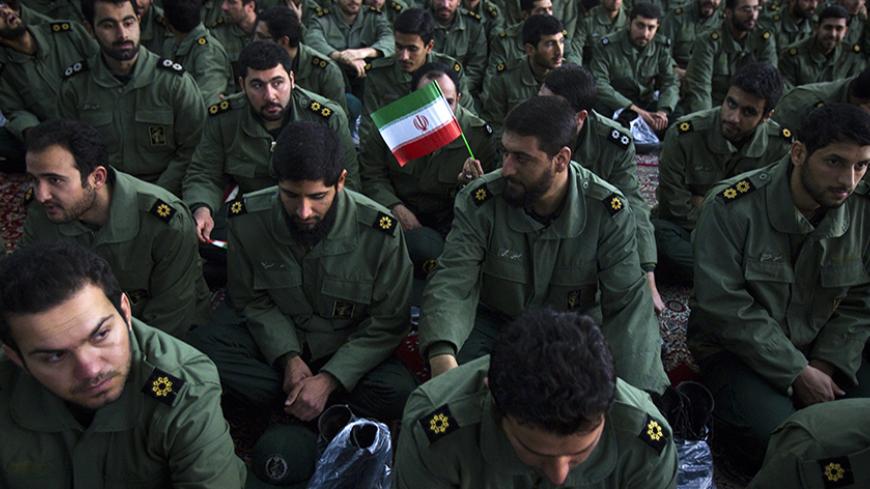 EDITORS' NOTE: Reuters and other foreign media are subject to Iranian restrictions on leaving the office to report, film or take pictures in Tehran.

Members of the revolutionary guard attend the anniversary ceremony of Iran's Islamic Revolution at the Khomeini shrine in the Behesht Zahra cemetery, south of Tehran, February 1, 2012. REUTERS/Raheb Homavandi  (IRAN - Tags: POLITICS ANNIVERSARY MILITARY) - RTR2X5DT