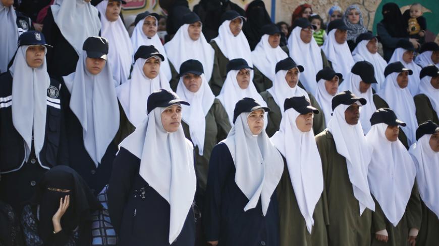 Hamas policewomen take part in a graduation ceremony for members of Hamas security forces in Gaza City December 17, 2012. REUTERS/Suhaib Salem (GAZA - Tags: POLITICS MILITARY) - RTR3BO8W