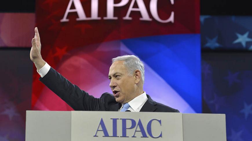 Israeli Prime Minister Benjamin Netanyahu acknowledges applause as he arrives to address the American Israel Public Affairs Committee (AIPAC), in Washington, March 4, 2014. Netanyahu urged world powers on Tuesday not to allow Iran to retain the ability to enrich uranium, saying it must be stripped of all nuclear technologies with bomb-making potential. REUTERS/Mike Theiler (UNITED STATES - Tags: POLITICS TPX IMAGES OF THE DAY) - RTR3G15H
