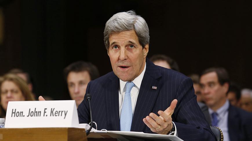 U.S. Secretary of State John Kerry testifies before a Senate Foreign Relations Committee hearing on "Authorization for the Use of Military Force Against ISIL" on Capitol Hill in Washington December 9, 2014. REUTERS/Yuri Gripas (UNITED STATES - Tags: POLITICS CIVIL UNREST CONFLICT) - RTR4HCK4