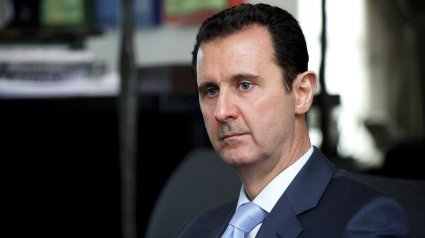 Syria's President Bashar al-Assad is seen during an interview in Damascus with the magazine, Literarni Noviny newspaper, in this handout picture taken January 8, 2015 by Syria's national news agency SANA. Syrian President Bashar al-Assad urged states fighting terrorism to share intelligence, Syrian state media reported on January 14 saying European policies were responsible for attacks by Islamist gunmen in France last week. Condemning the Paris attacks, Assad accused Western policymakers of being short sig