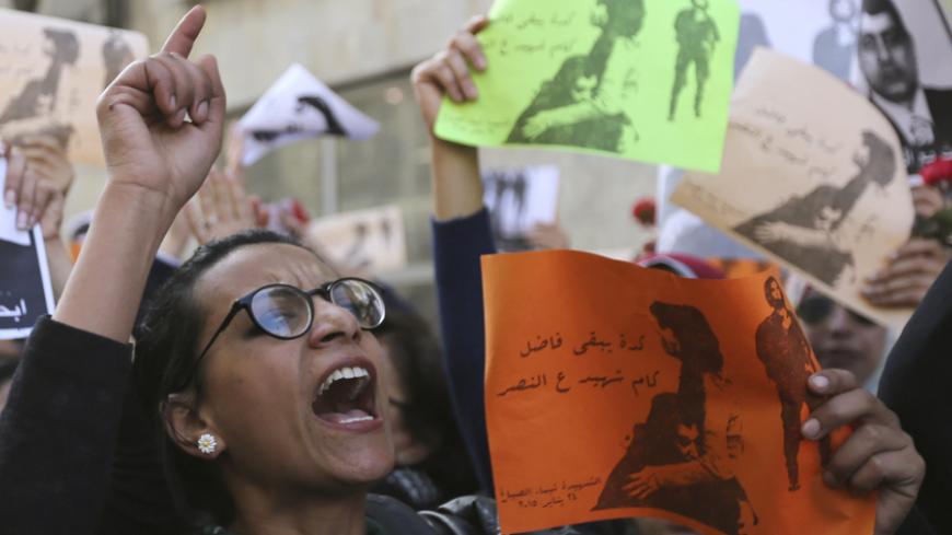 A protester chants anti-government slogans during a protest by women at the same location in central Cairo where activist Shaimaa Sabbagh was killed during a protest on Saturday, January 29, 2015. A group of women protested in Cairo on Thursday against the death of Sabbagh and around 25 other activists allegedly killed by security forces at recent rallies marking the anniversary of Egypt's 2011 uprising. Sabbagh, 32, died on Saturday as riot police were trying to break up a small, peaceful demonstration. Fr
