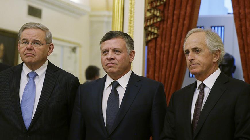 Jordan's King Abdullah (C) meets with members of the U.S. Senate Foreign Relations Committee, including Senators Robert Menedez (D-NJ) (L) and Bob Corker (R-TN) (R) in Washington February 3, 2015. Jordanian King Abdullah cut short a visit to the United States on Tuesday after Islamic State militants released a video purporting to show a captive Jordanian pilot being burnt alive.       REUTERS/Gary Cameron   (UNITED STATES - Tags: POLITICS) - RTR4O3XM