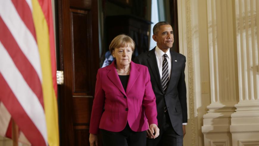 U. S. President Barack Obama and German Chancellor Angela Merkel arrive to address a joint news conference in the East Room of the White House in Washington February 9, 2015.   REUTERS/Gary Cameron (UNITED STATES  - Tags: POLITICS CIVIL UNREST)   - RTR4OW3R