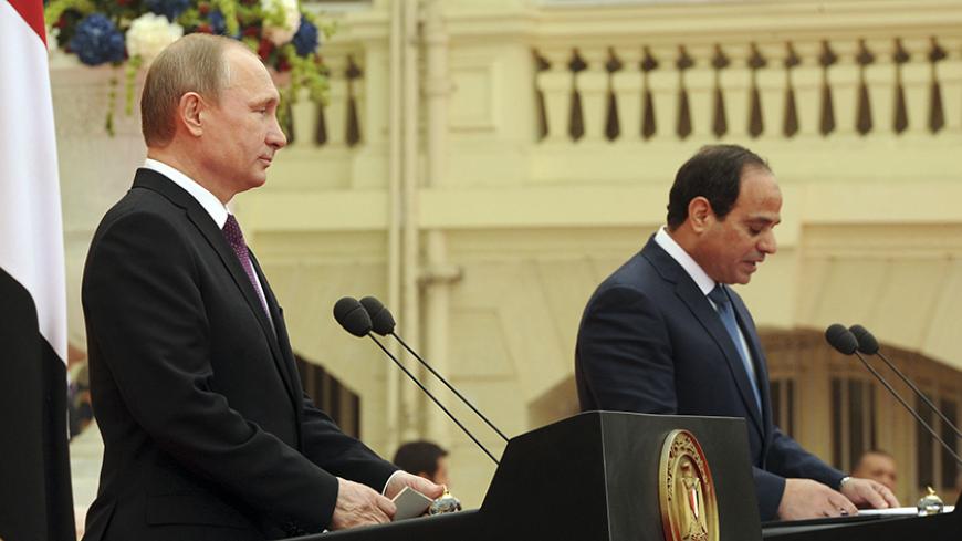 Russia's President Vladimir Putin (L) listens to his Egyptian counterpart Abdel Fattah al-Sisi at a news conference after their meeting in Cairo February 10, 2015. REUTERS/Mikhail Klimentyev/RIA Novosti/Kremlin (EGYPT - Tags: POLITICS) 

ATTENTION EDITORS - THIS IMAGE HAS BEEN SUPPLIED BY A THIRD PARTY. IT IS DISTRIBUTED, EXACTLY AS RECEIVED BY REUTERS, AS A SERVICE TO CLIENTS - RTR4P167