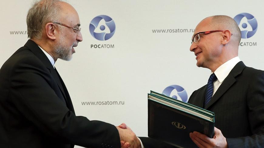 Sergei Kiriyenko (R), head of the Russian state nuclear monopoly Rosatom, and head of Iran's Atomic Energy Organisation Ali Akbar Salehi shakes hands during a signing ceremony in Moscow, November 11, 2014. Russia will build two new nuclear power plant units in Iran under an agreement signed in Moscow on Tuesday. REUTERS/Maxim Shemetov (RUSSIA - Tags: POLITICS ENERGY BUSINESS) - RTR4DP58