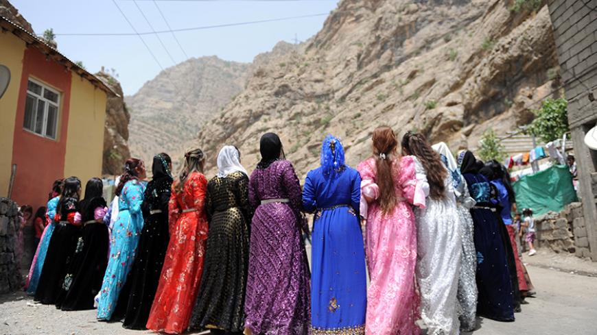 Kurdish women dance during a wedding ceremony at Yekmal village in the mountains of Hakkari on June 24, 2012. Hakkari is a province situated in the Eastern Anatolia region of Turkey, located at the juncture of Iraq and Iran. Mounts Cilo and Sat are the two towering ranges that dominate the topography. The population of Hakkari is mainly Kurdish. Winters are cold and harsh, and summers are hot and dry. Because of the extreme geographic conditions of the region, agriculture as a means of livelihood is limited