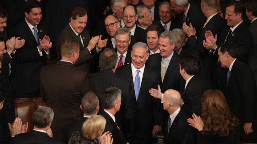 WASHINGTON, DC - MARCH 03:  Israeli Prime Minister Benjamin Netanyahu (C) is greeted by members of Congress as he arrives to speak during a joint meeting of the United States Congress in the House chamber at the U.S. Capitol March 3, 2015 in Washington, DC. At the risk of further straining the relationship between Israel and the Obama Administration, Netanyahu warned members of Congress against what he considers an ill-advised nuclear deal with Iran.  (Photo by Chip Somodevilla/Getty Images)